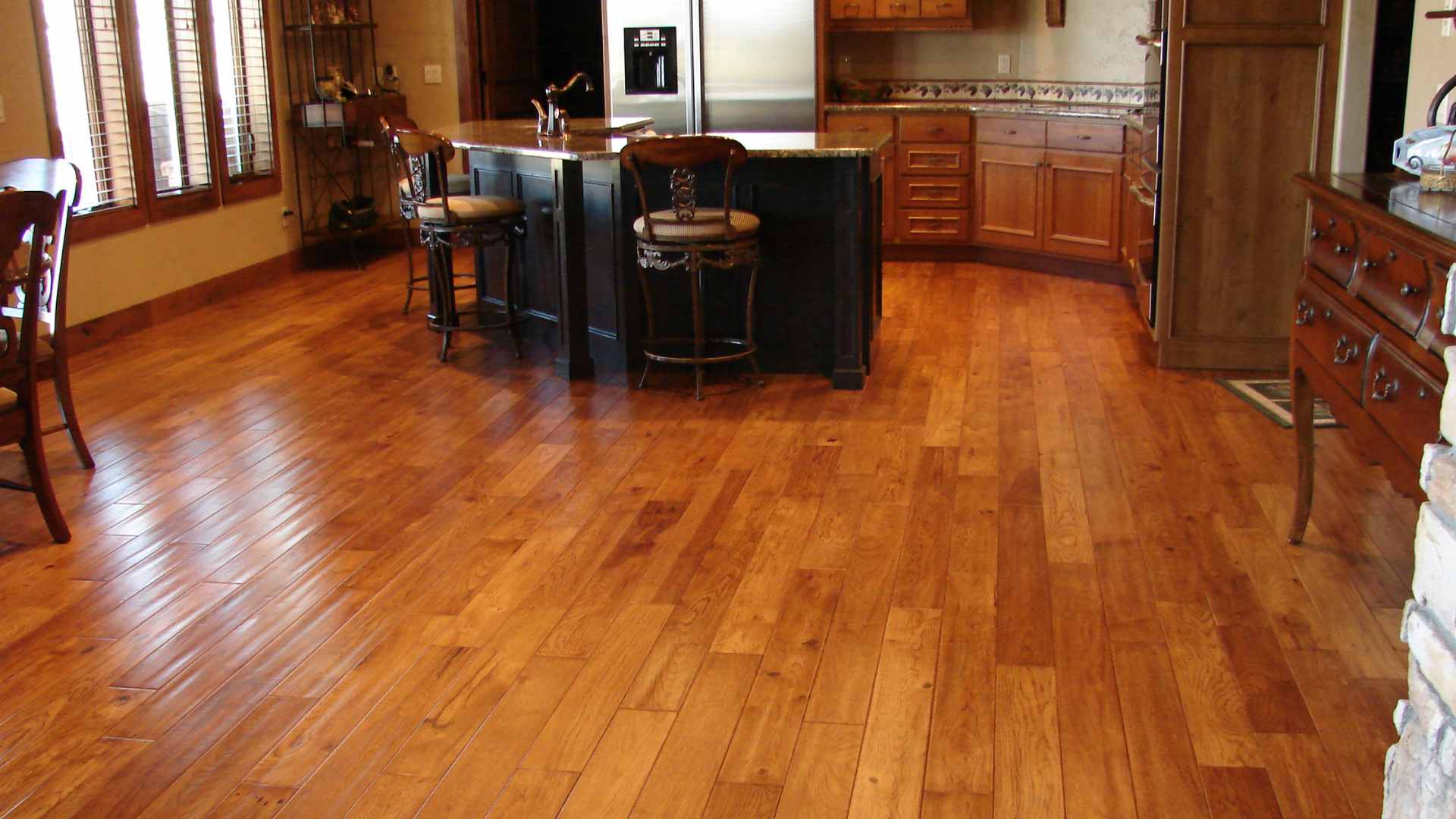 wood-look laminate flooring in kitchen with wood panelling